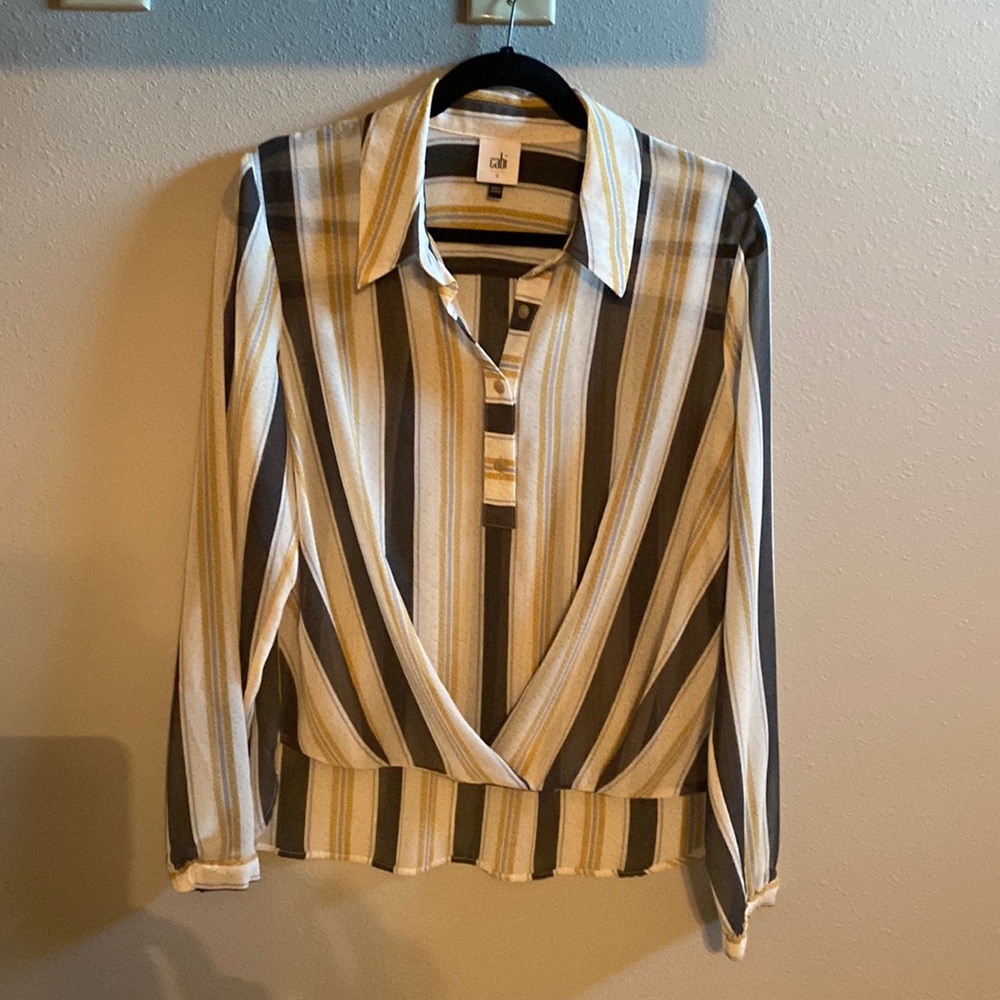 Cabi blouse.  Very sheer. Gathered detail in front. Longer in back.